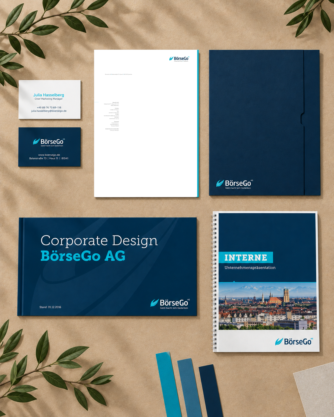 Corporate-Design-Collage der BörseGo AG mit Geschäftsausstattung auf braunem Papierhintergrund